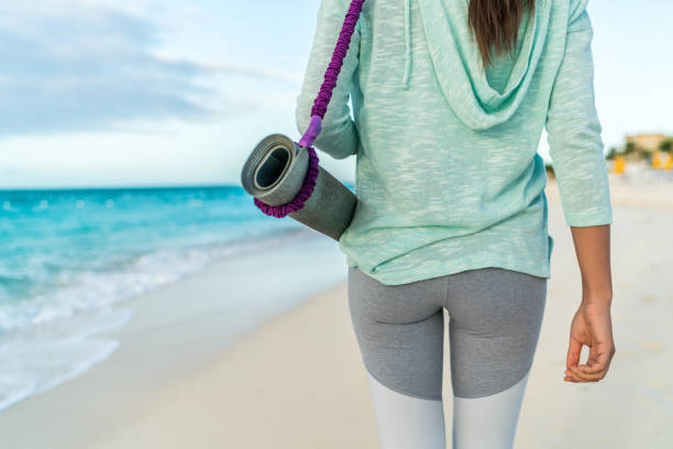 Fitness Beach Woman Carrying Yoga Mat With Strap Stock Photo - Download  Image Now - Yoga Class, Beach, Women - iStock