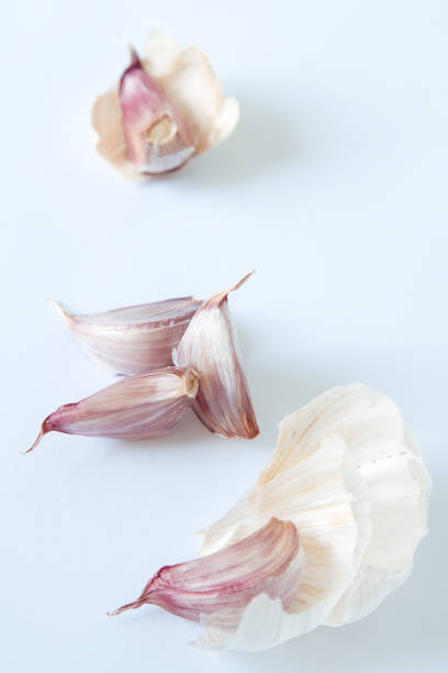 istock parts of a garlic on a white background 1330771544