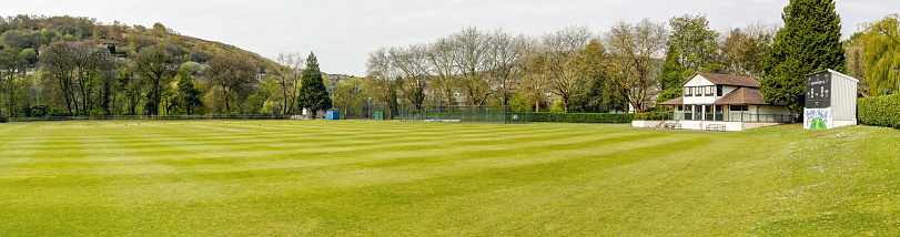 Pontypridd, Wales - April 2021: Panoramic view of the cricket ground in Ynysangharad Park in Pontypridd.