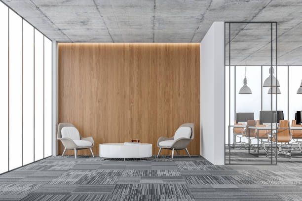 grande interno dell'ufficio: un angolo salotto con spazio di copia e wordesks dietro la porta di vetro - office lobby business contemporary foto e immagini stock