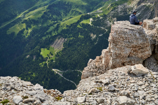 Tourists on the plateau Terrazza Delle Dolomiti Passo Pordoi in the Italian Dolomites. July 20 - 2021. People are hiking during summer at an altitude round 2950 meter over sea level. The glaciers are melting and leaving the mountain uncovered during summertime. Image from Northern Italy green valley denmark stock pictures, royalty-free photos & images
