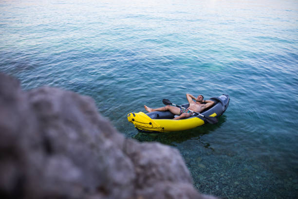 istock A fit young man sleeping in a kayak at the seaside 1330776141