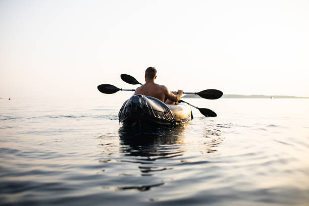 istock A young man kayaking with his small son at sunset 1330776166