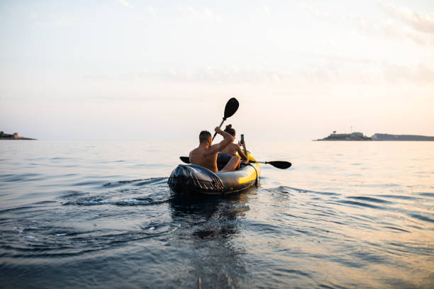 istock A young woman shooting a video while kayaking with her boyfriend 1330776215