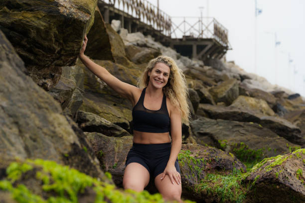 istock Woman running on the beach 1330776488
