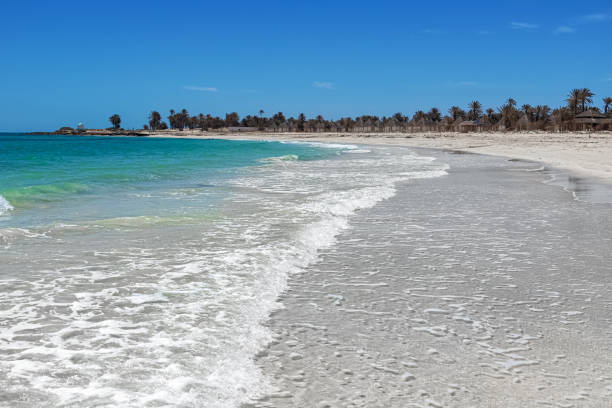 Wonderful view of the lagoon, seashore, white sand beach and blue sea. Djerba Island, Tunisia Seascape. Wonderful view of the lagoon, seashore, white sand beach and blue sea. Djerba Island, Tunisia djerba stock pictures, royalty-free photos & images
