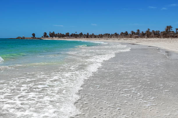Wonderful view of the lagoon, seashore, white sand beach and blue sea. Djerba Island, Tunisia Seascape. Wonderful view of the lagoon, seashore, white sand beach and blue sea. Djerba Island, Tunisia tunisia beach stock pictures, royalty-free photos & images