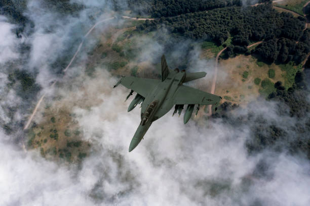 istock Jet fighters flying over the clouds. 1330779396