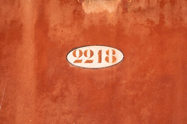 house number 2218 painted at a wall in orange