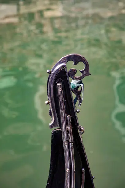 detail of iron bow element at a gondola as symbol for Venice