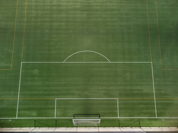 istock Artificial grass soccer field, view from the sky. 1330781691