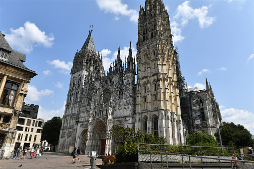 Rouen, France-07 21 2021:The Rouen Cathedral is a Roman Catholic church in Rouen, Normandy, France.It is famous for its three towers, each in a different style.It also has a place in art history as the subject of a series of impressionist paintings by Claude Monet.