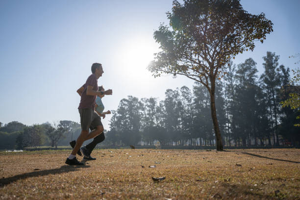 istock couple running in the park 1330782012