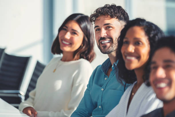 istock Group of people listening to a presentation. 1330784995
