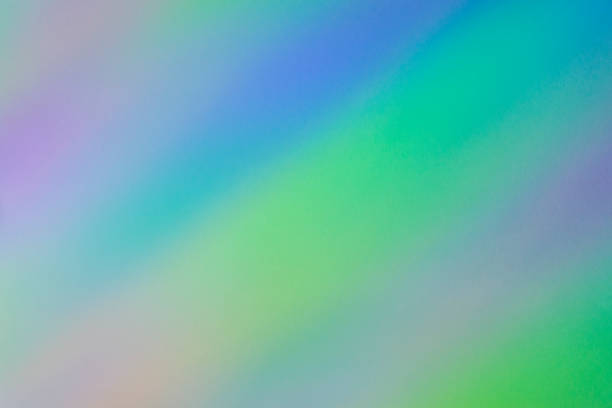 istock Blurred rainbow light refraction texture overlay effect for photo and mockups. Organic diagonal holographic flare on a white wall. Shadows for natural light effects 1330789379