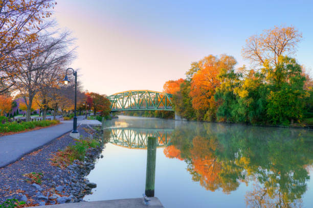 Beautiful Fall leaf colors with bridge and Canal-Pittsford, New York Beautiful Fall leaf colors with bridge and Canal-Pittsford, New York erie canal stock pictures, royalty-free photos & images