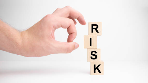 istock Hand hold wooden cubes with risk word. Risk management concept.White background. Copy space. 1330795258