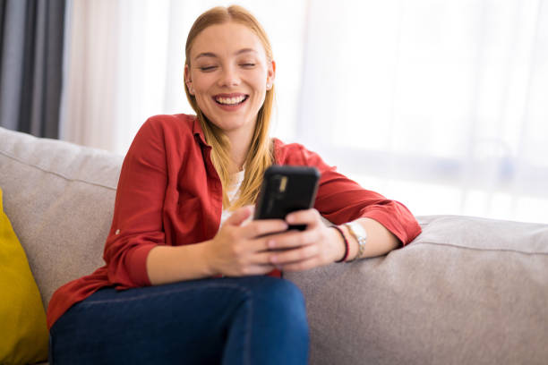 istock Young woman relaxing on sofa at home. 1330797339