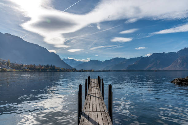 istock Beautiful landscape with mountains, lake and small pier during cloudy day. 1330797345