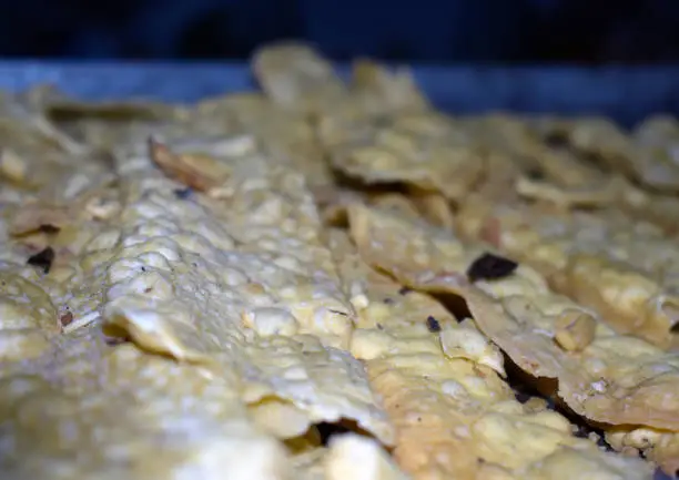 Photo of Closeup shot of the freshly baked Fafda Gujarati snack, Crispy Fafda,