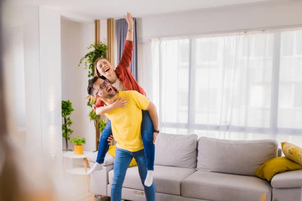 Young couple having fun at home. stock photo