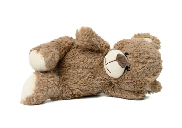 istock cute brown teddy bear lies on white isolated background 1330800273