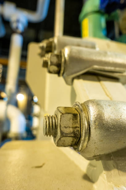 istock Equipment, cables and piping as found inside of industrial plant 1330804328