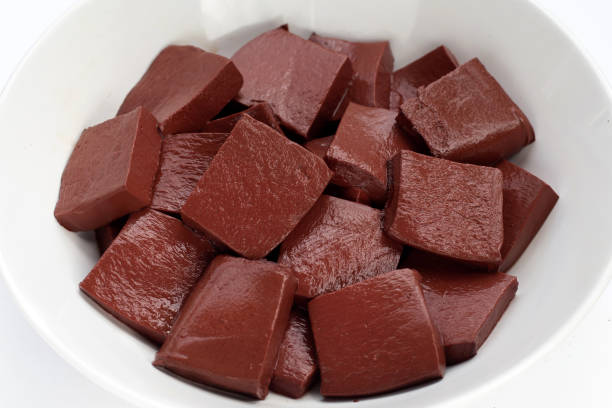 istock Pork blood pudding in white bowl on white background. 1330805227