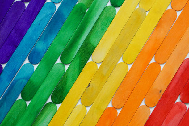 Rainbow colors popsicle sticks background pattern of colorful ice cream sticks for background, rainbow colors popsicle stick with LGTBQ background concept. popsicle stick stock pictures, royalty-free photos & images