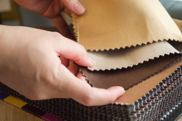 istock female designer with fabric color samples choosing textile for curtains 1330806907