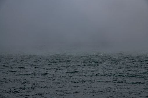 Beautiful seascape,  thick fog descended on the water after the storm.