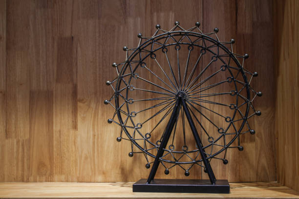 istock Vintage Ferris wheel on wooden background 1330819132