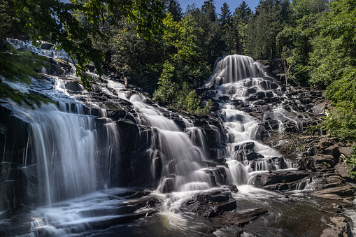 Chutes Waber Waterfalls in summer located in Parc national de la Mauricie, Quebec, Canada. At 27 metres in height, the falls have a water flow that varies with the seasons, offering spectacular panoramas.