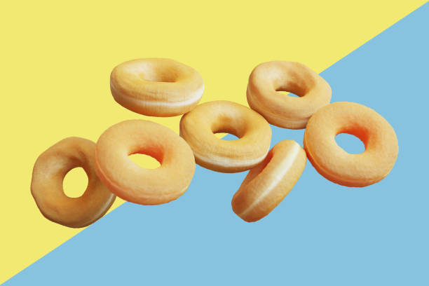 istock flying doughnuts various glazed doughnuts on pastel color background. 3D Render Food minimal idea concept. 1330819297