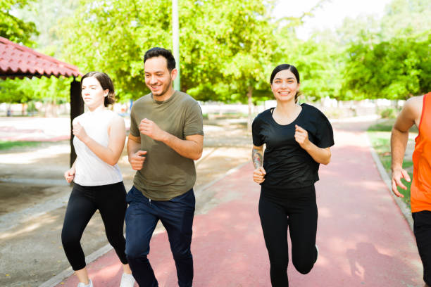 istock Cheerful friends jogging at the park track 1330822453