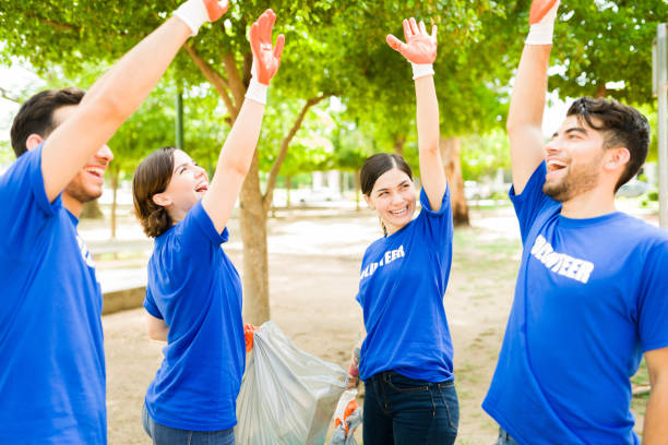 istock Happy latin volunteers doing a high five 1330822741