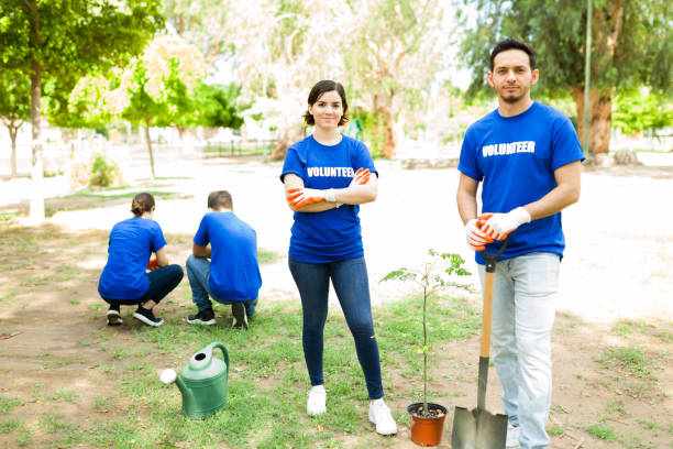 istock Attractive woman and man planting trees 1330822776