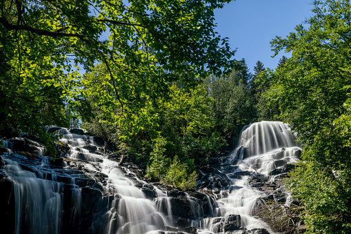 KRK waterfalls, woman watching sunset at the waterfall Croatia Krk national park Croatia