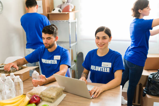 istock Hispanic beautiful woman checking the donations 1330830877