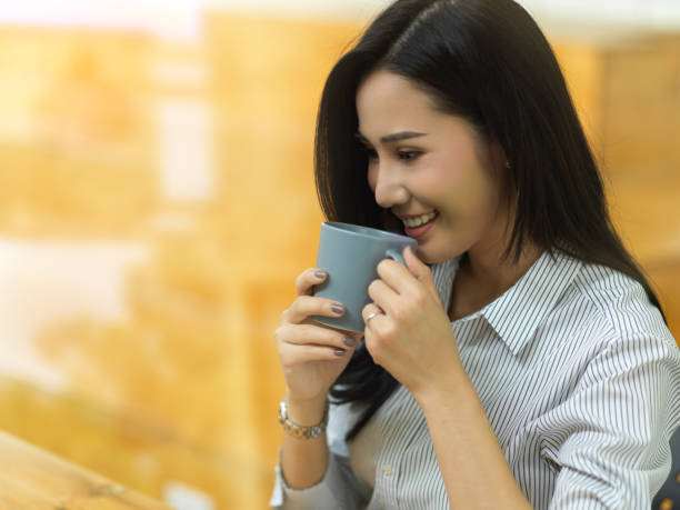 istock Pretty employee drink coffee in her coffee break 1330831835