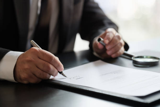 istock Businessman Signing Contract In The Office 1330832889