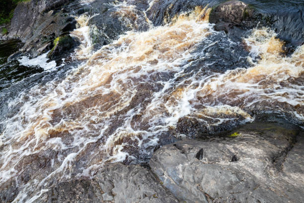 istock Waterfalls of Ruskeala, fast water with foam 1330833665