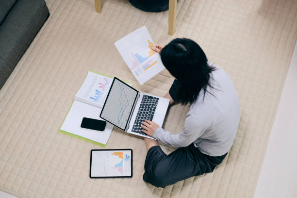 istock Asian woman working hard at home 1330833878