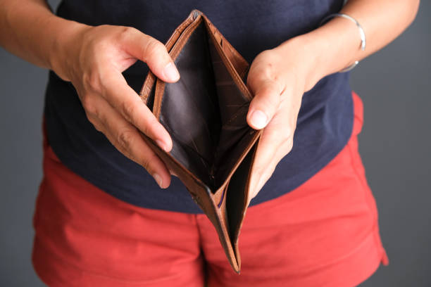 istock The young man's hand opened his wallet without money. 1330835930