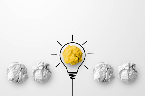 istock Concept creative idea and innovation. Paper scrap ball yellow colour outstanding different group with light bulb symbol 1330837866