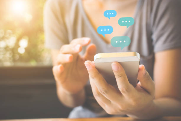 istock Woman using mobile smartphone. Online live chat chatting on application communication digital media website and social network 1330838395