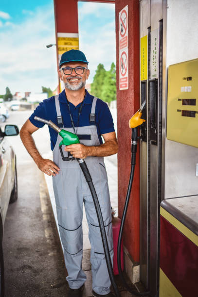 istock Mature man working on gas station. 1330844892