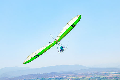 Young Man Flying in Hang Glider without engine in La Cumbre, Colima, Mexico