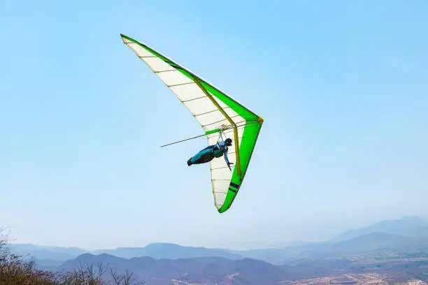 Young Man Flying in Hang Glider without engine in La Cumbre, Colima, Mexico