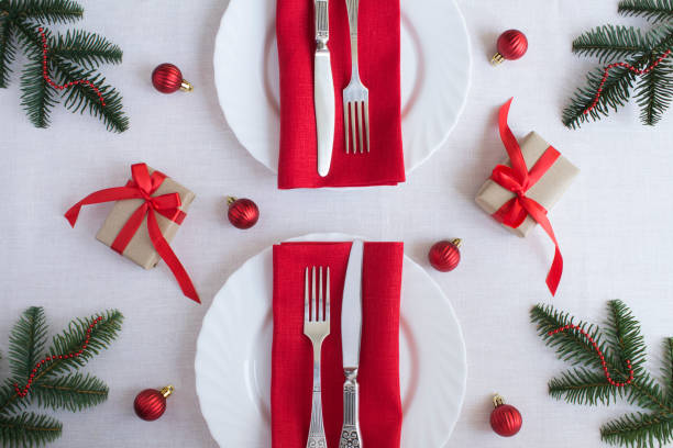 istock Christmas table setting on the white tablecloth. Top view. Close-up. 1330846076